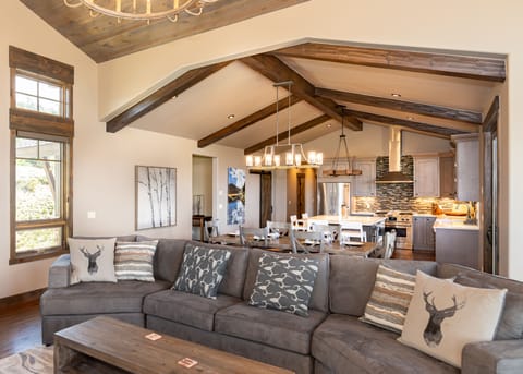 Open concept main level with living and dining areas, and kitchen.