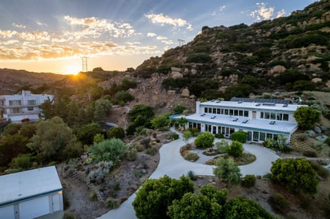 The house sits at the top of the Santa Susana Mountains at the end of a private road.