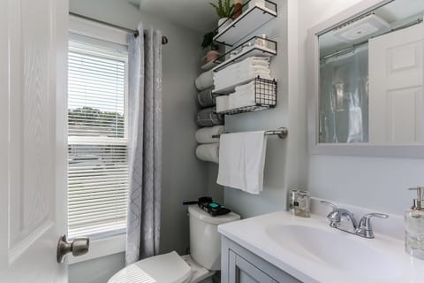 Combined shower/tub, hair dryer, towels, soap