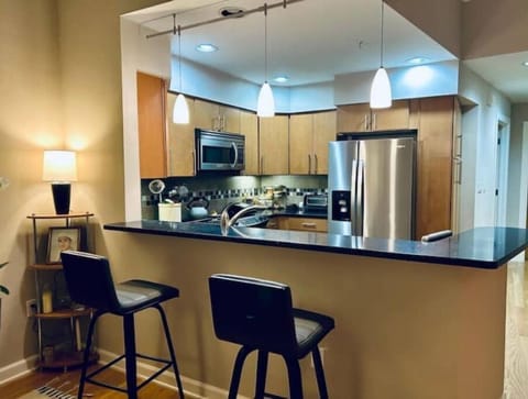 Seating for 2 at the bar, seating for 4 at the table. (4th chair not shown.)