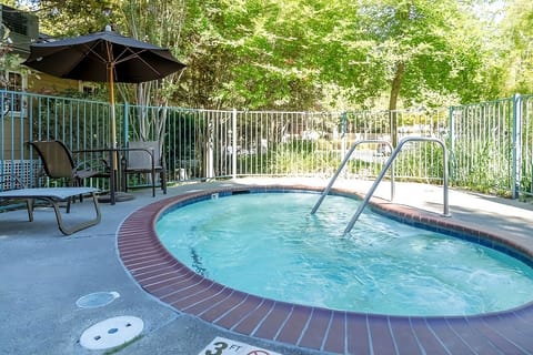 Sink into the steamy spa while birdsong fills the air.