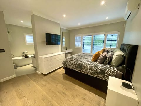 Main bedroom (XL King bed), en-suite bathroom and private toilet - downstairs