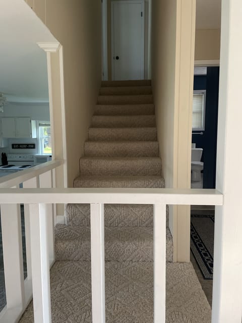 Stairs to access upstairs bedroom.