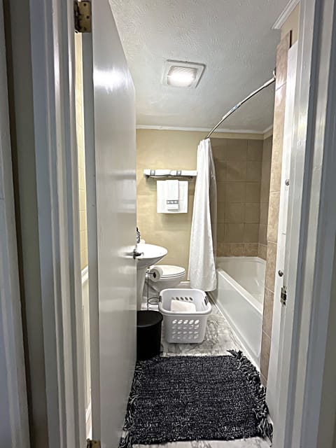 Combined shower/tub, hair dryer, towels, soap