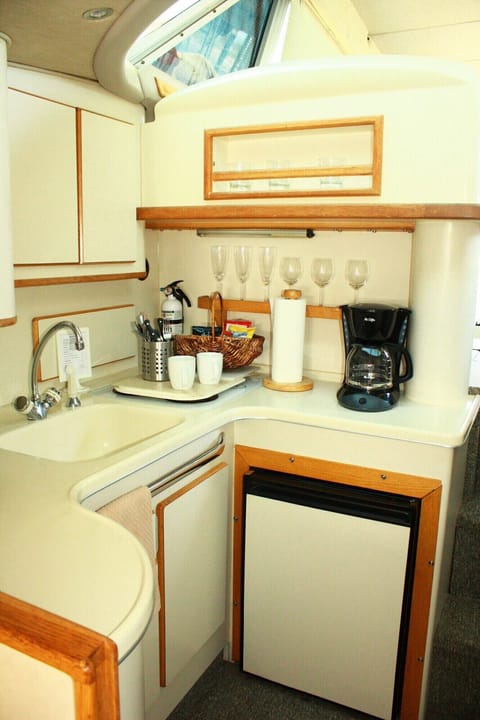 Fridge, microwave, coffee/tea maker, cookware/dishes/utensils