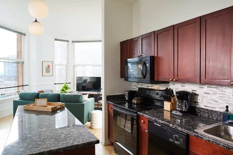 Gourmet kitchen with island is open to the living room