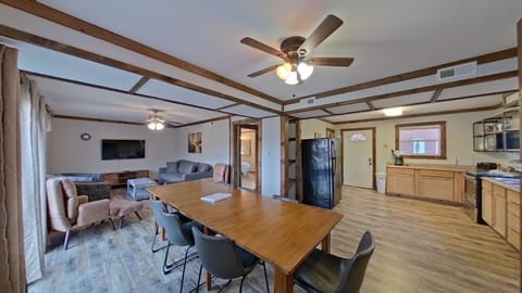 A welcoming retreat with plush seating and a generous dining table, perfect for relaxing and making lasting memories