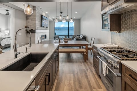 Thermador appliances, gas cooktop and Quartz countertops.