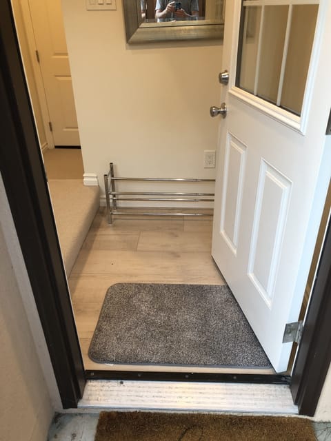 Guesthouse entrance. Secured door to main house visible in the background.