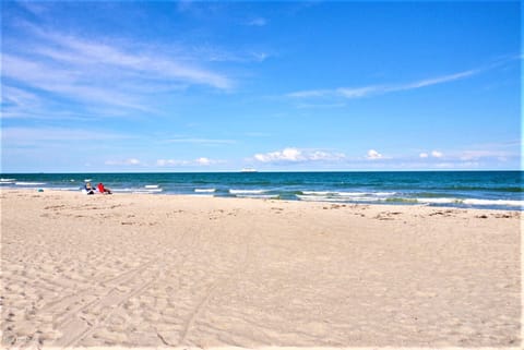 On the beach, sun loungers, beach towels