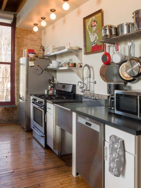 The kitchen is behind the dining area, offering ample space and all the essentials you need to cook and enjoy your stay. Whether you’re preparing a quick breakfast or a family dinner, the layout ensures easy flow between the dining and cooking areas.