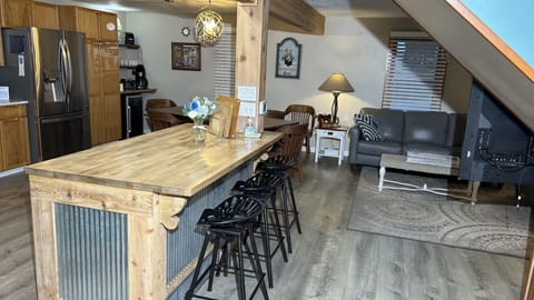 Enter into Large Eat-In Kitchen with lots of counter space & to Living Room Area