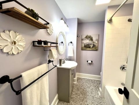 Combined shower/tub, hair dryer, towels, soap