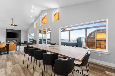 Meals taste better with a view! Dine together at the stunning live edge table while gazing out over the lake.