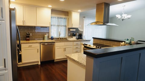 Granite counter tops and 3 different coffee machines await 