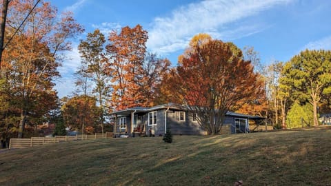 Cozy up this fall with stunning autumn views right from the porch. Surrounded by vibrant colors, this peaceful retreat is perfect for your seasonal escape.