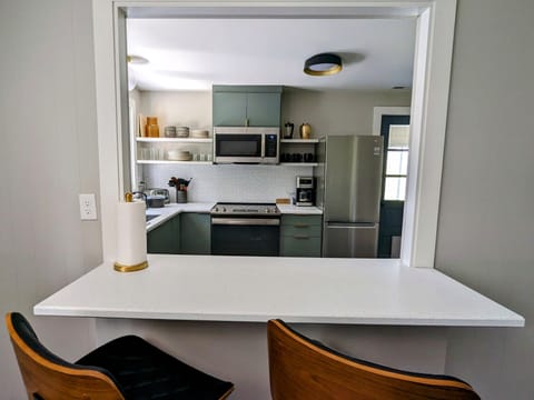 Bar Seating that looks into the Fully Equipped Chef's Kitchen
