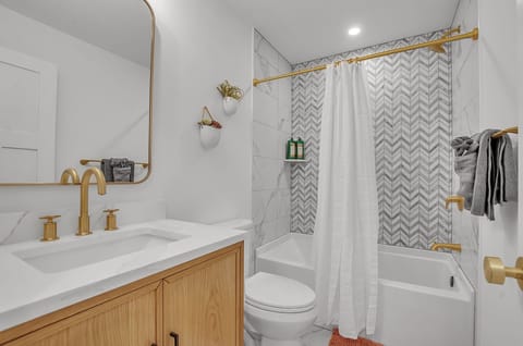 Combined shower/tub, hair dryer, towels, soap