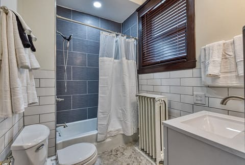 Combined shower/tub, towels, soap, toilet paper