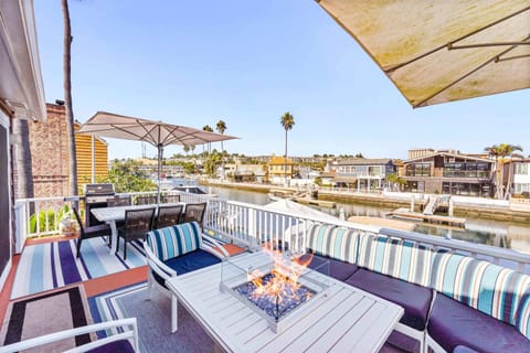 Enjoy your private second floor patio offering a firepit, outdoor dining table and gorgeous bay views.