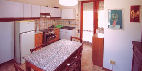 Fridge, oven, stovetop, dining tables