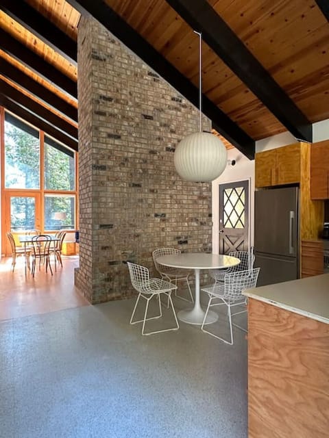 Front entry into kitchen and looking towards upper living room / dining area