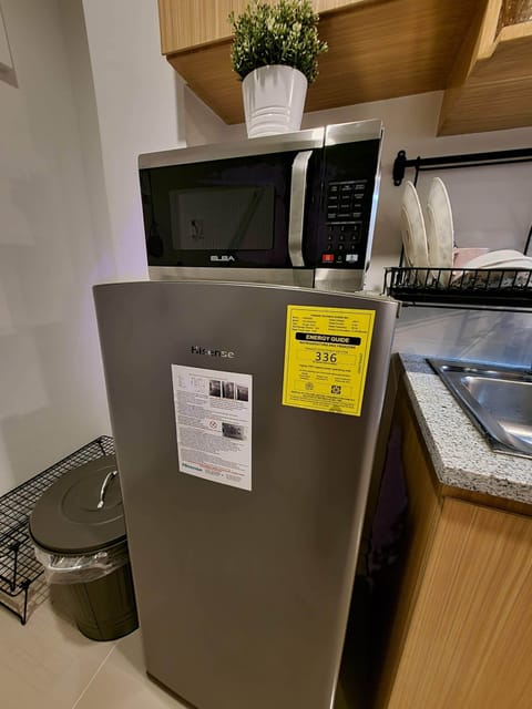 Fridge, microwave, electric kettle, cookware/dishes/utensils