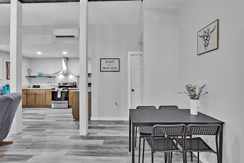 The dining is behind the living area, and the bathroom is through the door straight ahead