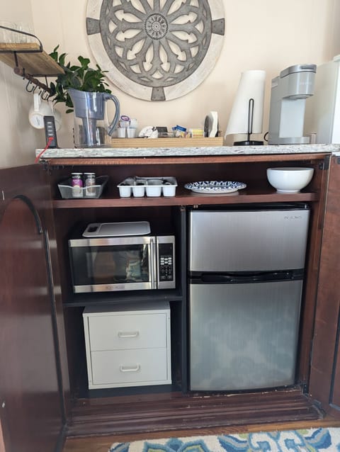 Fridge, microwave, coffee/tea maker, cookware/dishes/utensils