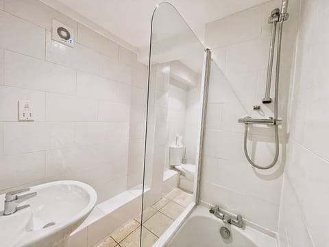 Combined shower/tub, hair dryer, towels, soap