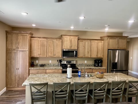 Granite,Refrigerator/Freezer,Stove/Double Oven,Microwave,2 Dishwashers,Garbage Disp.,2 Coffee Makers, Ninja Blender, Griddle, CrockPots, Almost every kitchen implement needed to make a meal.