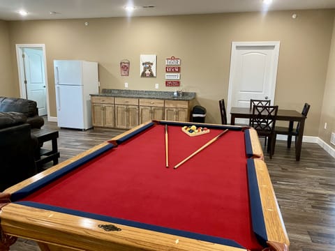 Upper level living area with 3 full size couches, a 75" HD Smart TV, & Local Cable, near the pool table & wet bar!