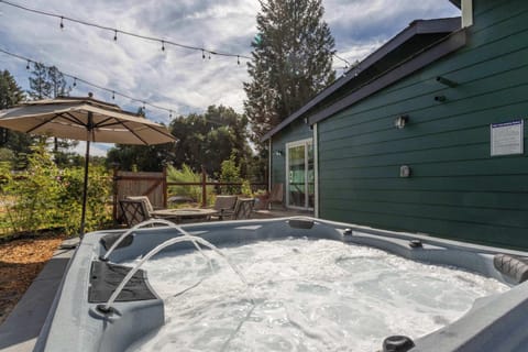 Unwind in the hot tub and soak up the peaceful backyard vibes.