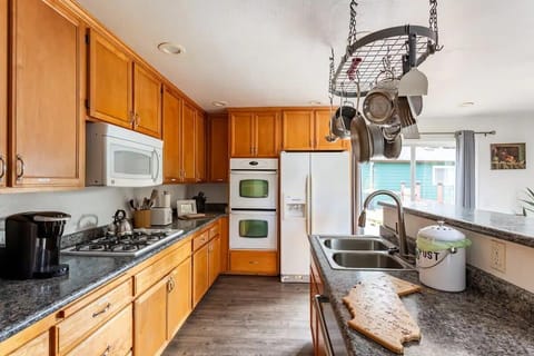 Stocked with pots, pans, and spices, our kitchen is ready for family meals and gatherings.