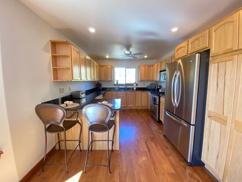 The large well appointed kitchen features top-of-the-line, stainless steel appliances
