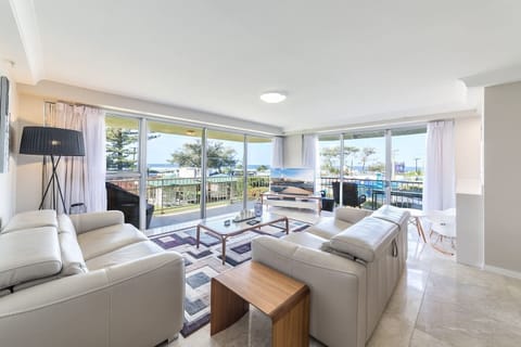 Take in gorgeous ocean views form the living area. It is fitted with two comfortable sofas so there's plenty of room for everyone to relax.