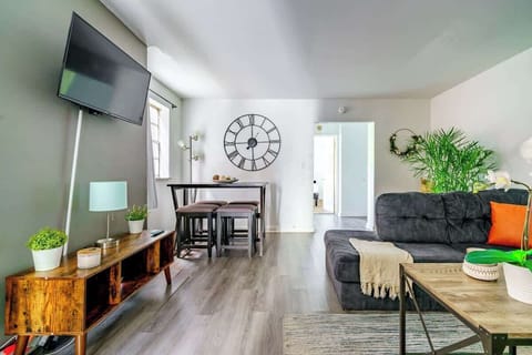 Nature Meets Luxury: Step into a spacious living room filled with lush indoor plants and high-end fixtures & amenities