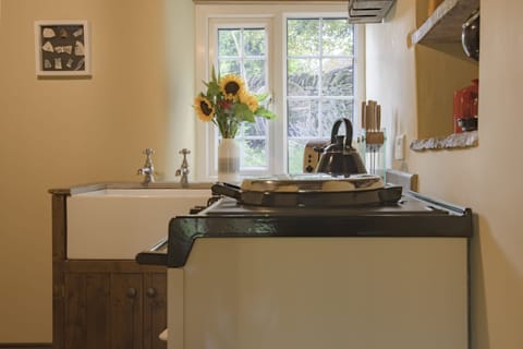 Ground floor: Kitchen overlooking the pretty garden to the rear of the cottage