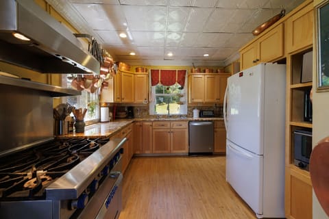 Microwave, oven, dishwasher, dining tables