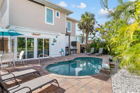 Salty Air Retreat is a 1 minute walk to sandy beaches or enjoy our private pool!