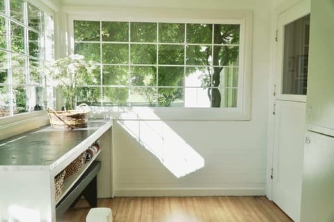 Step through the mudroom door into the kitchen.