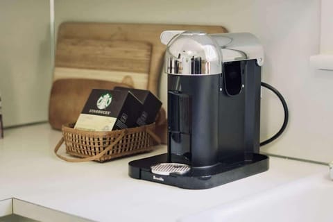 Begin your morning with a brew from the Nespresso coffee machine.