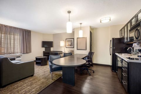 Spread out in an open, airy suite with comfortable seating.