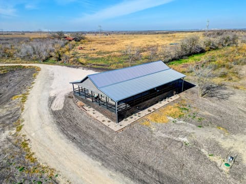Aerial view of the approach to the back of the home.  Guests will drive by the side enroute to the parking in the front of the home.