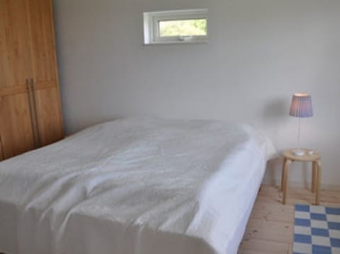 Master bedroom with enough space for a baby crib or an extra bed if needed.