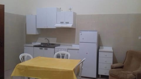 Fridge, stovetop, toaster, cookware/dishes/utensils