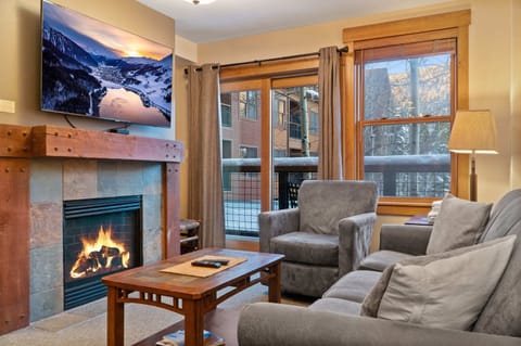 Experience the ultimate mountain getaway in this modern two-bedroom, two-bathroom condo in the heart of River Run Village.