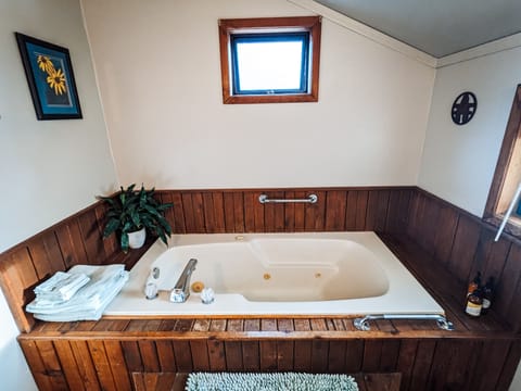 Jetted tub, eco-friendly toiletries, hair dryer, towels