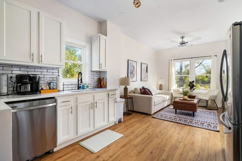 Fully Stocked Kitchen Open to Living Room