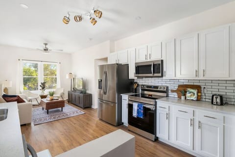 Fully Stocked Kitchen Open to Living Room